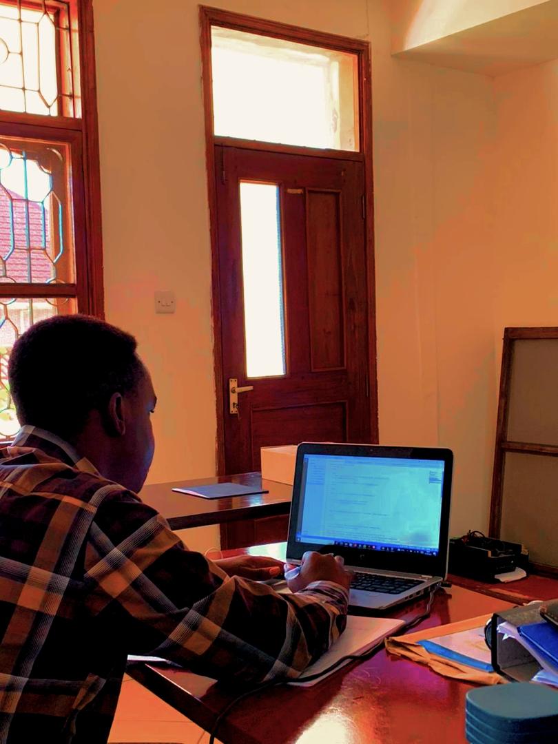 Valence Mwigani developing at a workstation